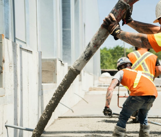 a group of construction workers working on a building