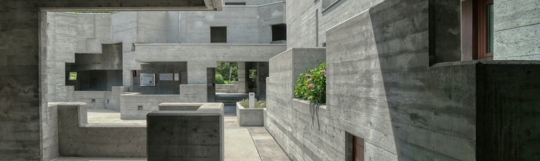 gray-concrete-building-during-daytime.jpg gray concrete building during daytime