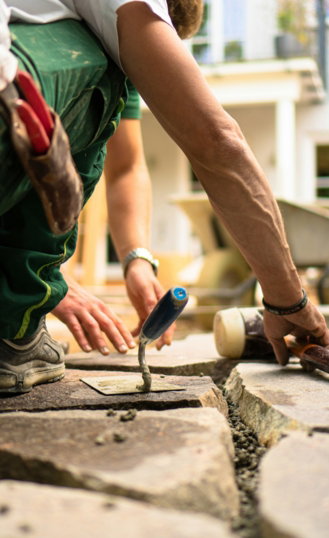 a man working on a piece of concrete