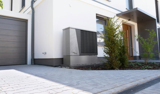 modern-house-exterior-with-heat-pump-unit-.jpg Modern house exterior with heat pump unit.