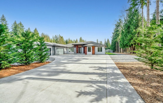 white-concrete-house-near-green-trees-under-blue-sky-during-daytime.jpg white concrete house near green trees under blue sky during daytime