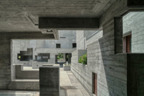 gray-concrete-building-during-daytime.jpg gray concrete building during daytime