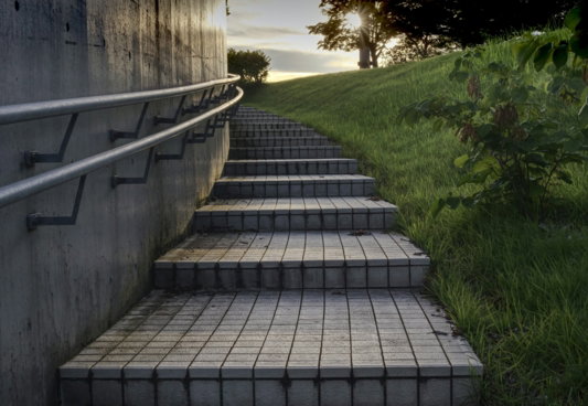 a wooden walkway between two buildings